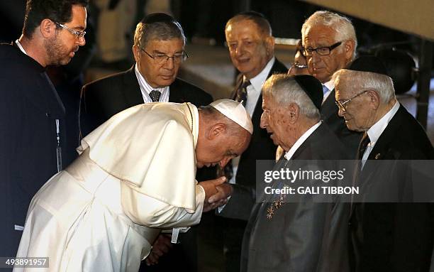 Pope Francis shakes the hand of holocaust survivor Eliezer Grynfeld during his visit to the Yad Vashem Holocaust Memorial museum in Jerusalem...