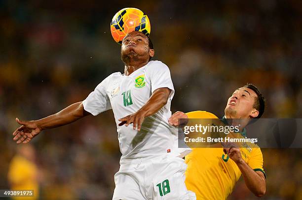 Jason Davidson of the Socceroos and Thuso Phala of South Africa contest the ball during the International Friendly match between the Australian...