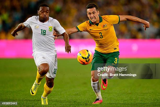 Jason Davidson of the Socceroos and Thuso Phala of South Africa contest the ball during the International Friendly match between the Australian...