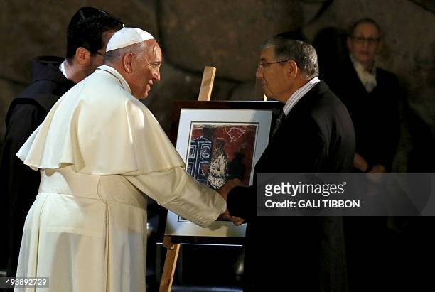 Yad Vashem Chairman, Avner Shalev , presents Pope Francis on May 26 with a replica of a painting Prayer, created by Abraham Koplowicz in the Lodz...