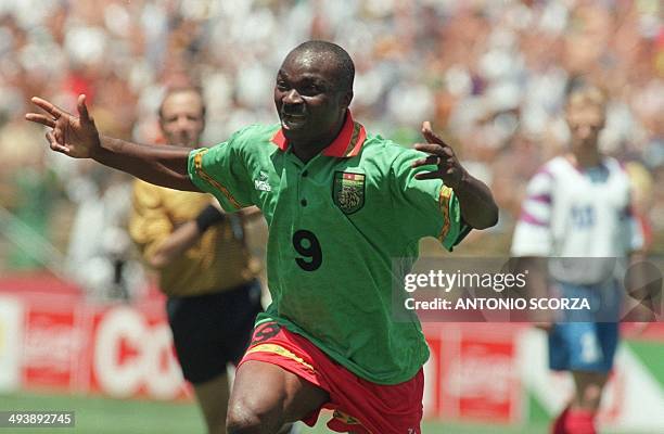 Cameroon's forward Roger Milla celebrates after scoring a goal against Russia 28 June 1994 at Stanford stadium in San Francisco during their Soccer...