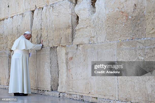 Pope Francis prays in front of the Western Wall, Judaism's holiest site, in the Old City of Jerusalem on May 26, 2014. The Vatican's Pope Francis on...