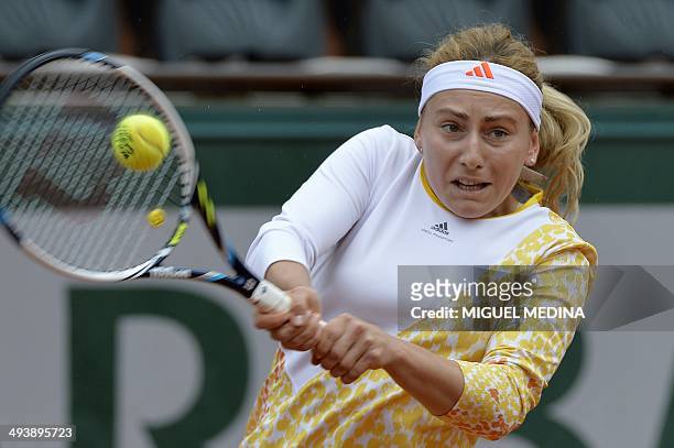 Russia's Ksenia Pervak serves to Russia's Maria Sharapova during their French tennis Open first round match at the Roland Garros stadium in Paris on...