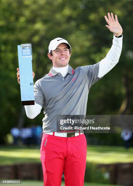 Rory McIlroy of Northern Ireland poses with the trophy following his victory at the end of day four of the BMW PGA Championship at Wentworth on May...