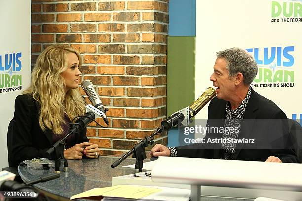 Singer Carrie Underwood talks with Elvis Duran during "The Elvis Duran Z100 Morning Show" at Z100 Studios on October 22, 2015 in New York City.