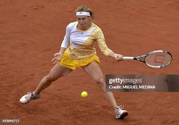Russia's Ksenia Pervak hits a return to Russia's Maria Sharapova during their French tennis Open first round match at the Roland Garros stadium in...