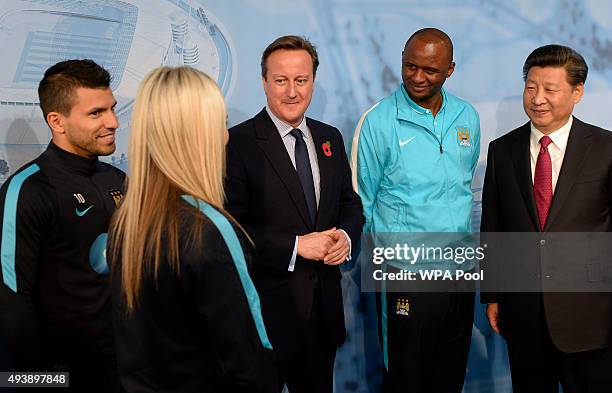 China's President Xi Jinping and Britain's Prime Minister David Cameron meet Manchester City's Sergio Kun Aguero , Manchester City Women's Toni...