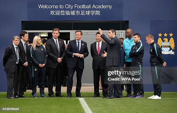 Britain's Prime Minister David Cameron and China's President Xi Jinping with Manchester City chairman Khaldoon Al Mubarak during a visit to the City...