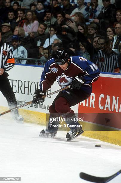 Adam Deadmarsh of the Colorado Avalanche stops to get the puck during an NHL game against the Toronto Maple Leafs on February 17, 2001 at the Air...