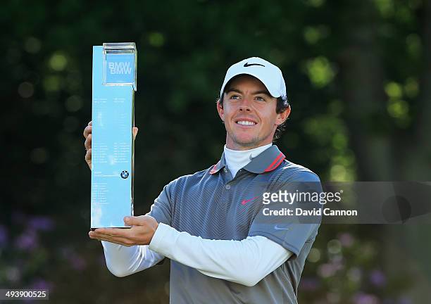 Rory McIlroy of Northern Ireland poses with the trophy following his victory at the end of day four of the BMW PGA Championship at Wentworth on May...