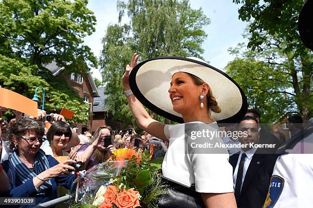 Queen Maxima of the Netherlands waves to the public outside the Marinekompetenz Zentrum Leer on May 26, 2014 in Leer, Germany. The King and the Queen...