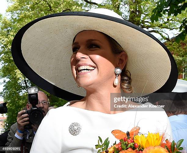 Queen Maxima of the Netherlands waves to the public outside the Marinekompetenz Zentrum Leer on May 26, 2014 in Leer, Germany. The King and the Queen...