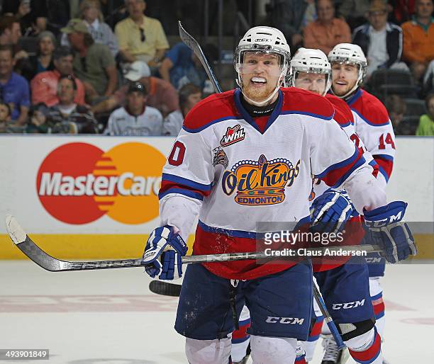 Henrik Samuelsson of the Edmonton Oil Kings skates back to the bench happy after securing the win with an empty net goal against the Guelph Storm in...