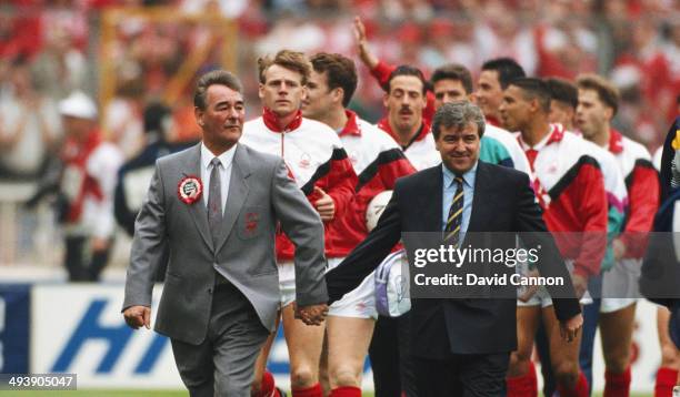 Tottenham Hotspur manager Terry Venables and Nottingham Forest manager Brian Clough lead the teams out hand in hand before the 1991 FA Cup Final...