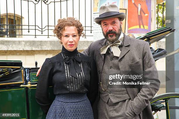 Actors Birgit Minichmayr as Bertha von Suttner and Sebastian Koch as Alfred Noble pose during the 'Madame Nobel' set visit on May 26, 2014 in Vienna,...