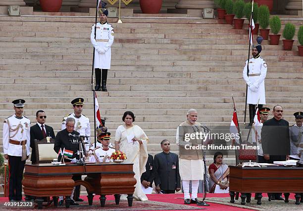 Narendra Modi takes oath as the 15th Prime Minister of India, at a ceremony at Rashtrapati Bhavan on May 26, 2014 in New Delhi, India. 63-year-old...
