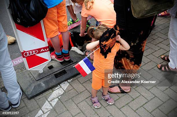 Small girl plays hide-and-seek under the skirt of her Mum, while she waits for King Willem-Alexander of the Netherlands and Queen Maxima at the AUDI...