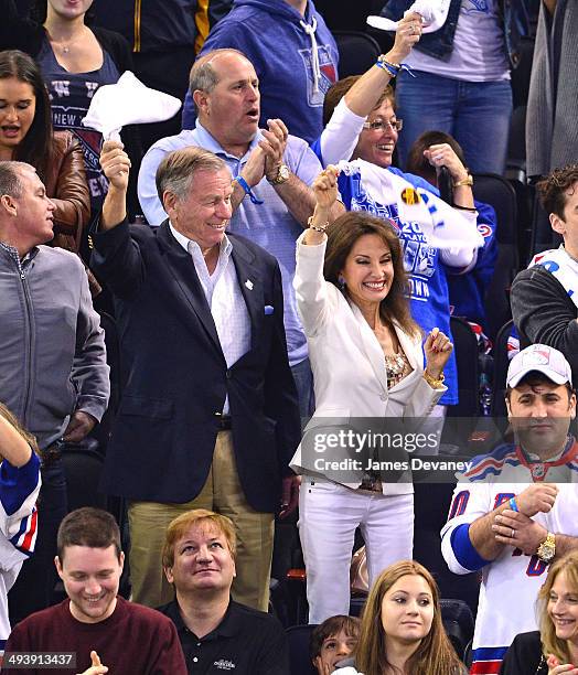 Helmut Huber and Susan Lucci attend Montreal Canadiens vs New York Rangers playoff game at Madison Square Garden on May 25, 2014 in New York City.