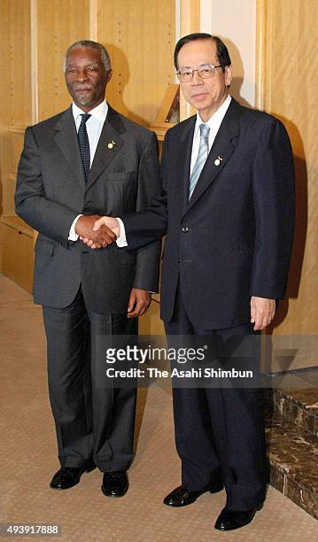 South African President Thabo Mbeki and Japanese Prime Minister Yasuo Fukuda shake hands during their meeting on the sidelines of the G8 Summit on...