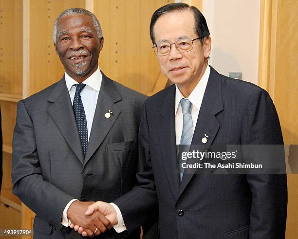 South African President Thabo Mbeki and Japanese Prime Minister Yasuo Fukuda shake hands during their meeting on the sidelines of the G8 Summit on...