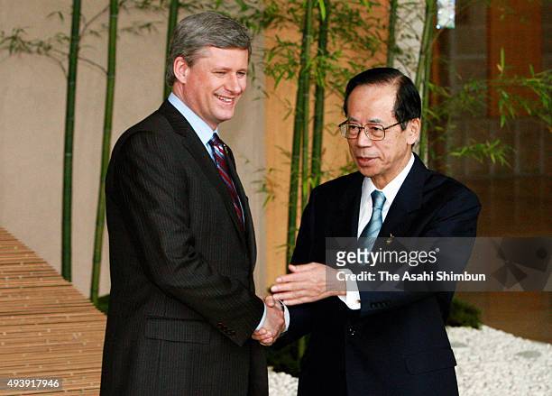 Japanese Prime Minister Yasuo Fukuda welcomes Canadian Prime Minister Stephen Harper during the G8 Summit on July 7, 2008 in Toyako, Hokkaido, Japan.
