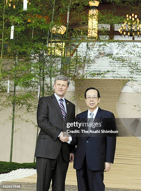 Japanese Prime Minister Yasuo Fukuda welcomes Canadian Prime Minister Stephen Harper during the G8 Summit on July 7, 2008 in Toyako, Hokkaido, Japan.