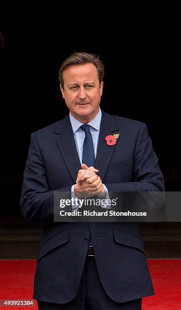 Prime Minister David Cameron waits for President Xi Jinping to arrive for lunch at Manchester Town Hall on October 23, 2015 in Manchester, England....