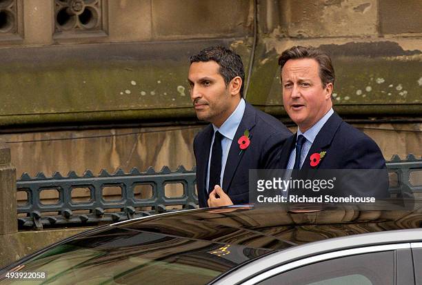 Khaldoon Al Mubarak and Prime Minister David Cameron waits for President Xi Jinping to arrive to have lunch at Manchester Town Hall on October 23,...