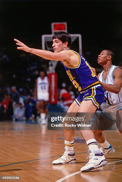 John Stockton of the Utah Jazz calls for the ball against the Charlotte Hornets on December 22, 1989 at the Charlotte Coliseum in Charlotte, North...