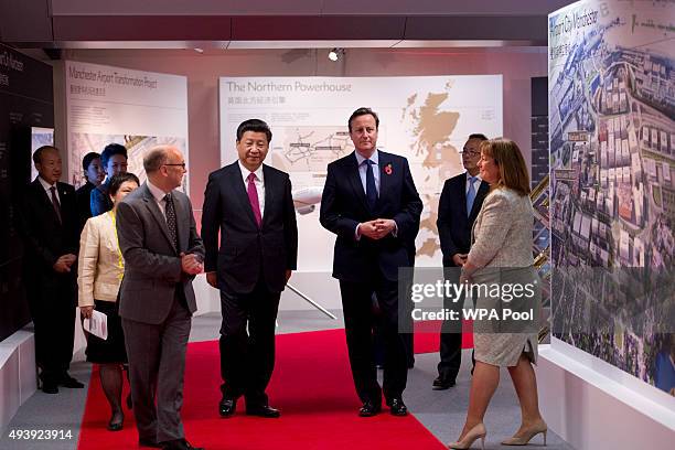 President of the People's Republic of China Xi Jinping and British Prime Minister David Cameron accompanied by the Chief Executive of The Manchester...