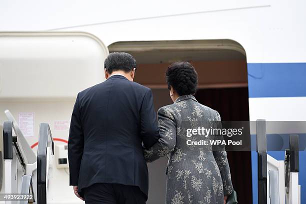 President of the People's Republic of China Xi Jinping and his wife Peng Liyuan board an Air China plane at Manchester airport at the end of their...