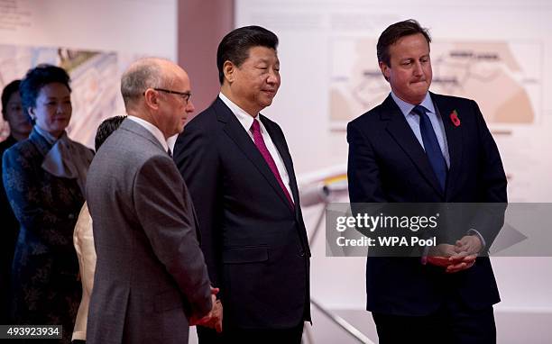 President of the People's Republic of China Xi Jinping and British Prime Minister David Cameron accompanied by the Chief Executive of The Manchester...