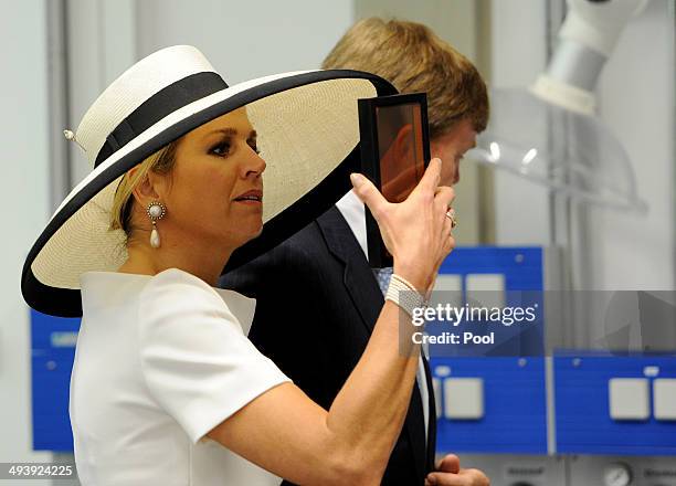 Dutch King Willem-Alexander and Dutch Queen Maxima during their visit of the EWE research center's laboratory 'Next Energy' on May 26, 2014 in...