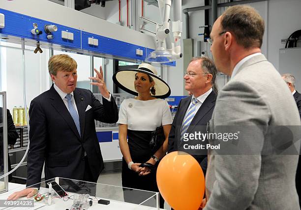 Dutch King Willem-Alexander and Dutch Queen Maxima talk to Lower Saxony's Prime Minister Stephan Weil and Alexander Dyck, division manager for fuel...