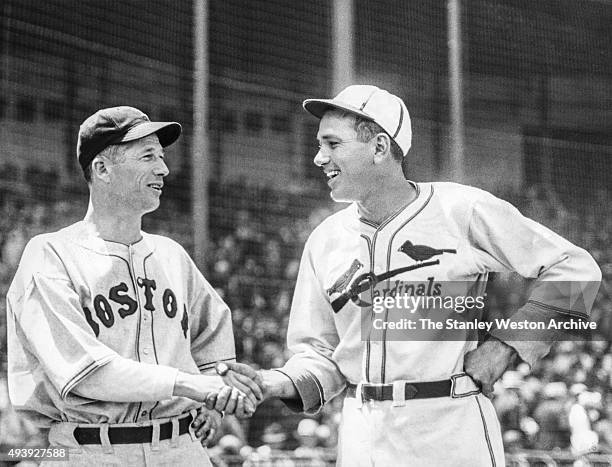 Starting pitchers for the 1936 All-Star Game Lefty Grove of the Boston Red Sox and Dizzy Dean of the St. Louis Cardinals shake hands before the start...