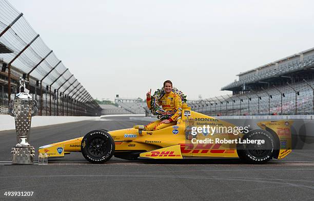 Ryan Hunter-Reay driver of the Andretti Autosport Dallara Honda poses with the Borg Warner Trophy at the yard of bricks during the Indianapolis 500...