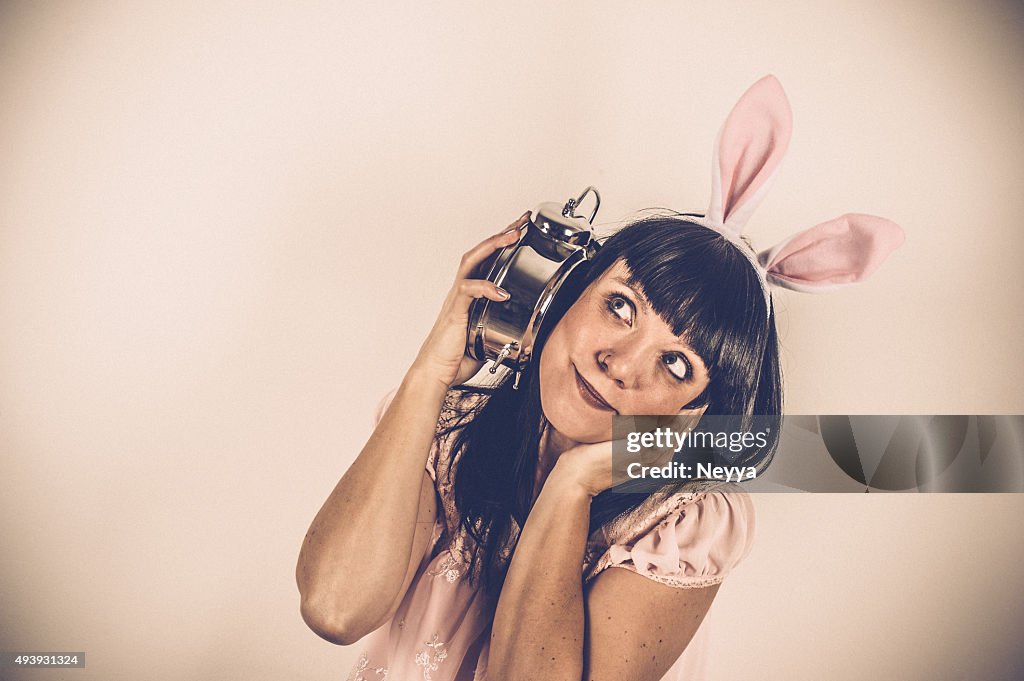 Easter Bunny weared Woman with Alarm Clock