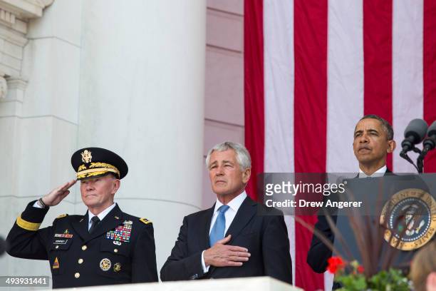 Martin Dempsey, Chairman of the Joint Chiefs of Staff, Secretary of Defense Chuck Hagel, and U.S. President Barack Obama stand together during a...