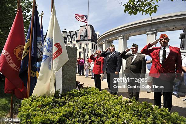 Veterans, left to right, Dallas Lykens, Frank Shultz, Robert Daughenbaugh, and Martin Kaschalk salute after laying a wreath at a memorial for all who...