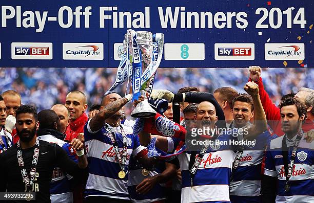 Danny Simpson , Bobby Zamora and the QPR team celebrate with the trophy after their victory in the Sky Bet Championship Playoff Final match between...