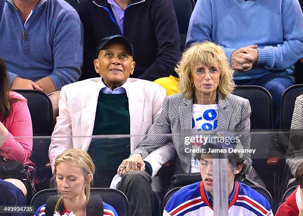 Harry Belafonte and Pamela Frank attend Montreal Canadiens vs New York Rangers playoff game at Madison Square Garden on May 25, 2014 in New York City.