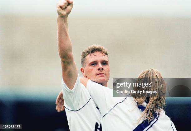 Tottenham Hotspur player Paul Gascoigne celebrates with Paul Walsh circa 1989 in London, England.