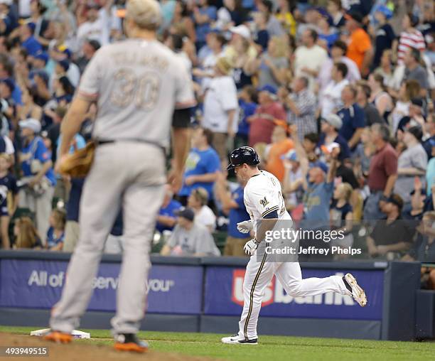 Lyle Overbay of the Milwaukee Brewers rounds the bases after hiting a home run against Chris Tillman of the Baltimore Orioles in the sixth inning of...