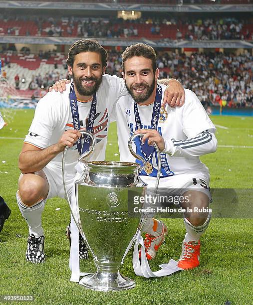 Alvaro Arbeloa and Dani Carvajal of Real Madrid lifts the Champions League trophy during the UEFA Champions League Final between Real Madrid and...