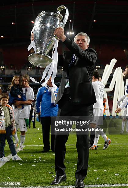 Carlo Ancelotti of Real Madrid lifts the Champions League trophy during the UEFA Champions League Final between Real Madrid and Atletico de Madrid at...