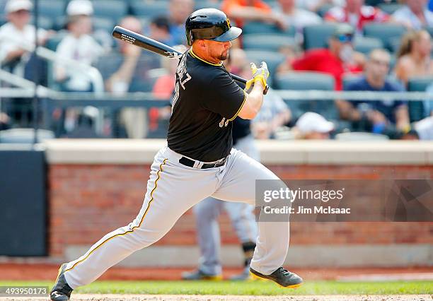 Gaby Sanchez of the Pittsburgh Pirates follows through on a ninth inning RBI single against the New York Mets at Citi Field on May 26, 2014 in the...