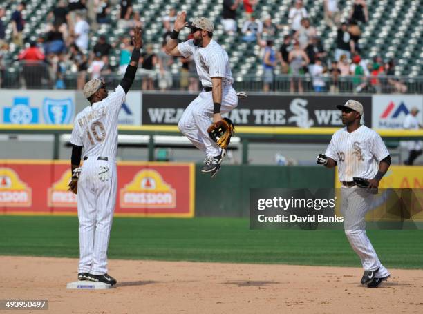Alexei Ramirez of the Chicago White Sox and Adam Eaton high-five after their win on May 26, 2014 at U.S. Cellular Field in Chicago, Illinois. The...
