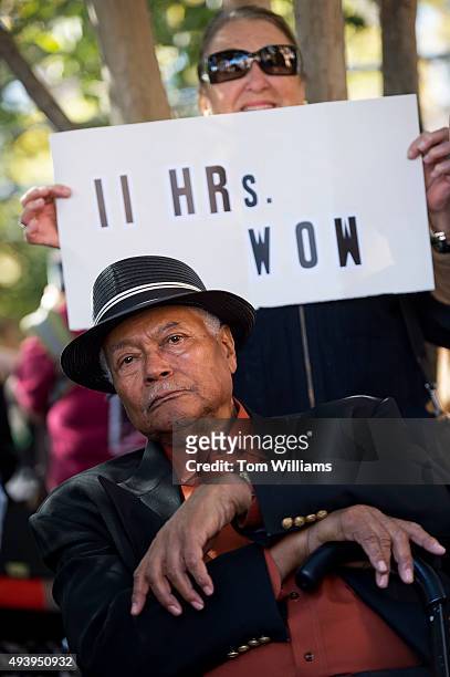 John Harper and Nieta Morrison attend a Hillary Rodham Clinton presidential campaign rally at the Market Square outside of City Hall in Alexandria,...
