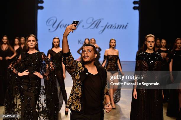 Yousef Al-Jasmi walks the runway after his show during Dubai Fashion Forward Spring/Summer 2016 at Madinat Jumeirah on October 23, 2015 in Dubai,...