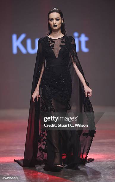 Model walks the runway at the Yousef Al-Jasmi show during Dubai Fashion Forward Spring/Summer 2016 at Madinat Jumeirah on October 23, 2015 in Dubai,...